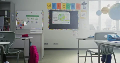 Interior of Modern Empty Elementary School Classroom with Desks for Students Stock Footage 315533801