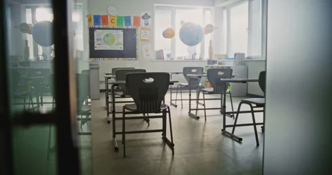 Interior of Modern Empty Elementary School Classroom with Desks for Students Stock Footage 315534620