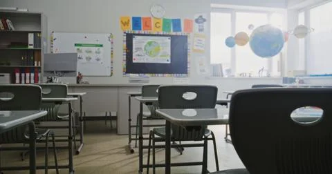 Interior of Modern Empty Elementary School Classroom with Desks, Chalkboard Stock Photos