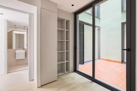 Interior of modern empty room in refurbished apartment with big black frame of 스톡 사진