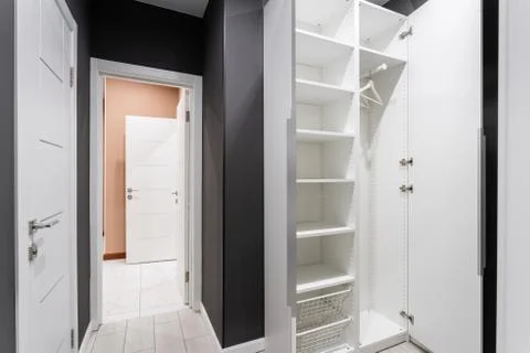 Interior of modern empty wardrobe room. Hotel modern standart room. simple and Stock Photos