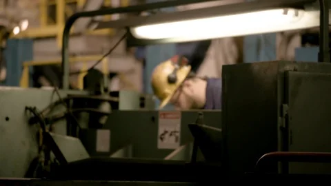 Interior Modern Factory Man at Lathe - Camera Focuses Stock Footage 89944577