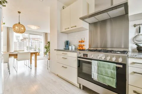 Interior of modern kitchen with dining zone Stock Photos