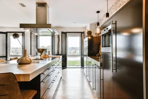 Interior of modern kitchen with windows Stock Photos