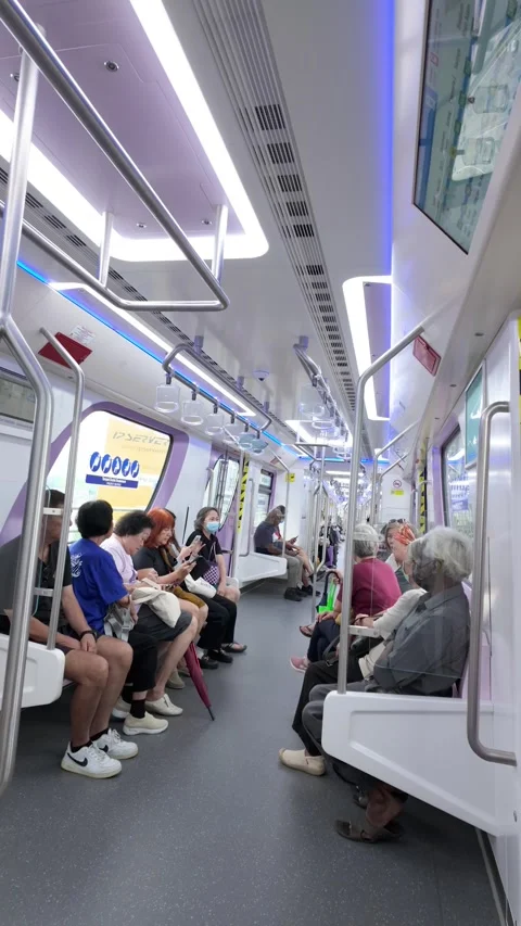 Interior of a modern LRT3 train carriage with passengers seated during a journey Stock Footage 342414580