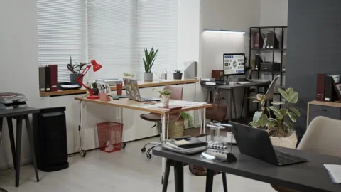 Interior of Modern Office Featuring Desks with Laptops, Documents and Notebooks Stock Footage 330517508