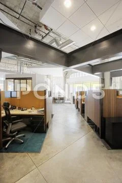 Interior of modern office space with cubicles Stock Photos