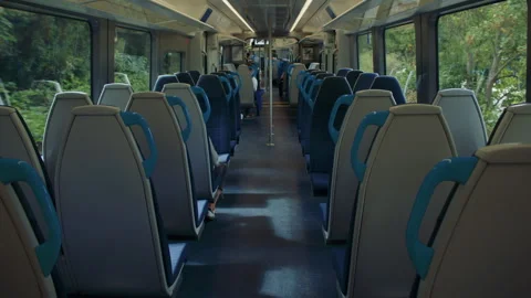 Interior of a modern passenger train with blue and white seats. 스톡 동영상 319724114