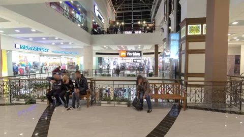 Interior in a modern shopping center with many shops timelapse hyperlapse. Stock Footage 265676136