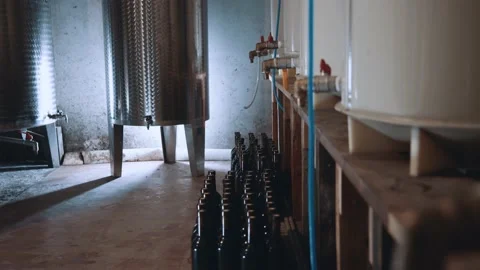 Interior of modern winemaking cellar. Rows of stainless steel distilling Stock Footage 148121765