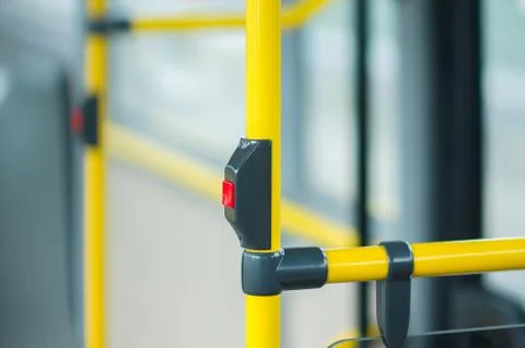 Interior of modrn city bus. stop alert buttons Stock Photos