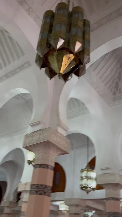 Interior of mosque with white arches and hanging chandeliers, Morocco Stock Footage 328684184
