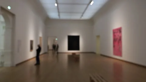 Interior museum: large room with visitors looking at modern art. Soft focus. Stock Footage 259042299