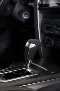 Interior of new unknown car with automatic transmission in dealer showroom. Stock Photos