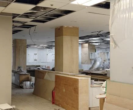 Interior office space undergoing renovation and construction work Photos