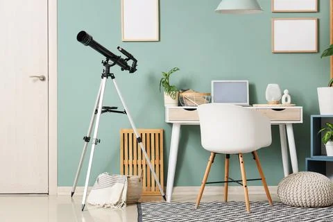 Interior of office with workplace and telescope Stock Photos