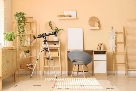 Interior of office with workplace, shelves and telescope Stock Photos