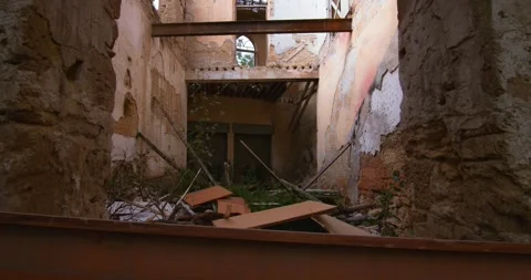 Interior of an old abandoned house. Old broken furniture, walls that have fallen Stock Footage 307067996
