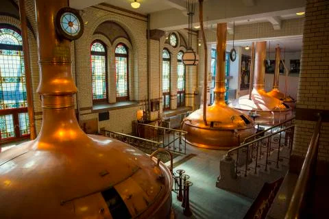 The interior of an old brewery with large copper vats Fotos Stock