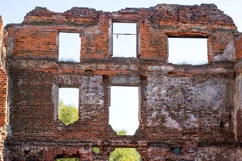 Interior of an old brick building, trees visible outside Fotos de archivo