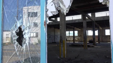 Interior of an old factory or warehouse with broken window foreground. Stock Footage 75682116