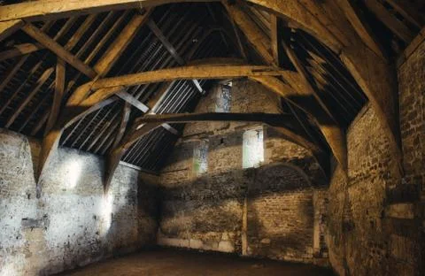 Interior of an old medieval barn in a typical village in England Stock Photos