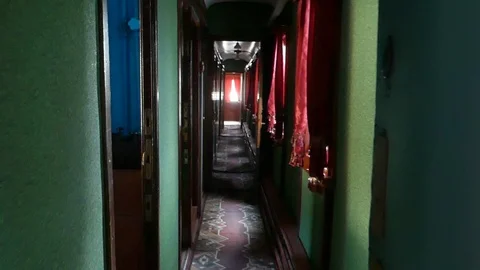 Interior of an old railway train. The camera sails along the corridor of the  Stock Footage 88785979