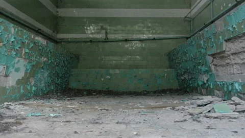 Interior of old room cracked ceramic tiles falling off from the wall Stock Footage 90665780