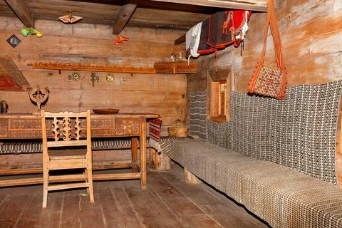 The interior of an old rural hut in the traditional Ukrainian style with carv Stock Photos