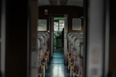Interior of an old style train looking towards the open drivers cabin. Vintage Stock Photos