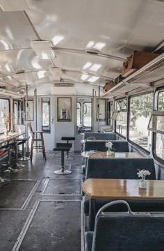 Interior of an old train transformed into a restaurant Stock Photos