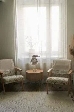 The interior of an open space with two designer armchairs in front of the window Stock Photos