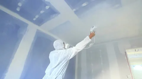 Interior Painter spraying walls with emulsion. Stock-Footage 12185351