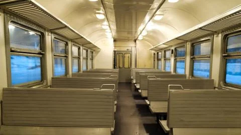 The interior of a passenger train with empty seats Stock Photos