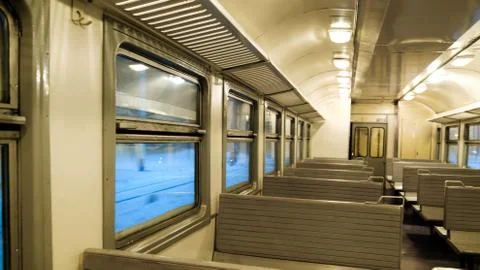 The interior of a passenger train with empty seats Stock Photos