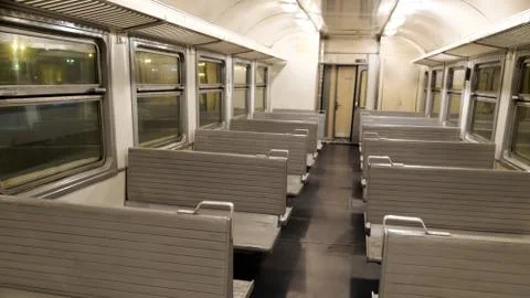 The interior of a passenger train with empty seats Stockfoto's