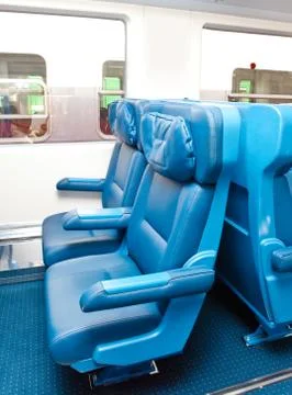 Interior of a passenger train with empty seats Stock Photos