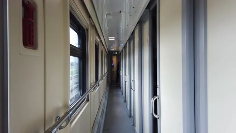 Interior of a passenger train, inside a compartment carriage, corridor. Stock Footage 169435525