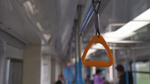 Interior of a passenger vehicle. Triangular plastic handrails for passengers Vídeo Stock 326351239