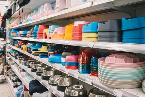 Interior of pet store with large assortment of pet accessories, bowls for pet Stock Photos