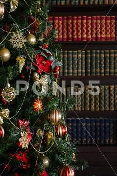 Interior photo studio with Christmas decor. Fireplace, Christmas tree, gifts of Stock Photos