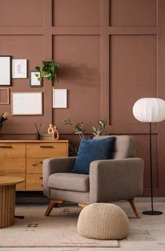 Interior of podcaster's studio with armchair, commode and lamp 库存照片