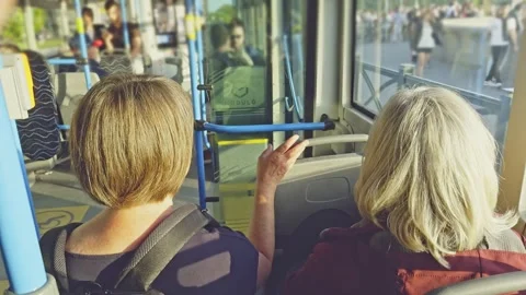 Interior point-of-view footage showing passengers travelling aboard a city tram Stock Footage 345284214