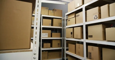 Interior of post office with shelves and carton boxes. Postal delivery room Stock Footage 125208601