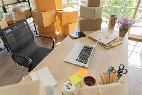 Interior of Postal parcel packaging carton box delivery and computer notebook 写真素材