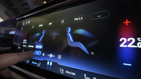 The interior of a premium car. Changes the climate control temperature on the di Stock Footage 268162762