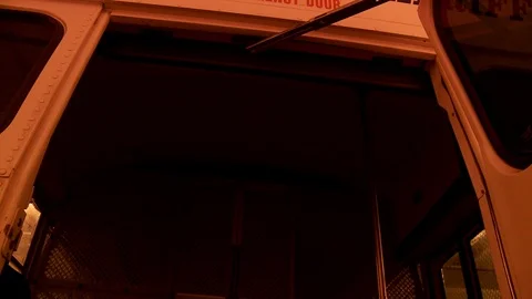 Interior prison bus with chains and handcuffs on floor. 스톡 동영상 106538446