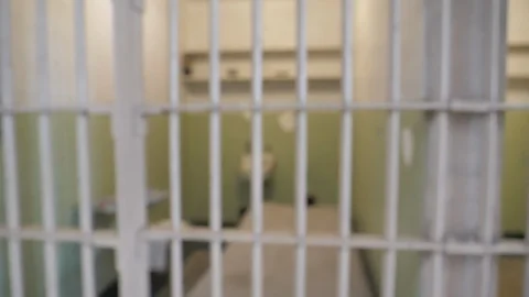 Interior Prison jail gaol cell iron bars detention captive punishment B-roll Stock Footage 121653964