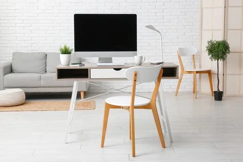 Interior of programmer's office with workplace and sofa Stock-Fotos