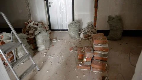 Interior renovation construction site with bricks and ladder 스톡 사진
